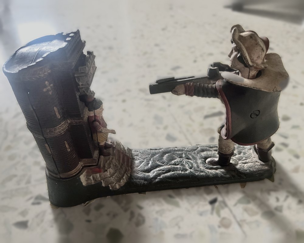Cast-iron William Tell mechanical bank with an archer aiming at a boy beside a castle tower